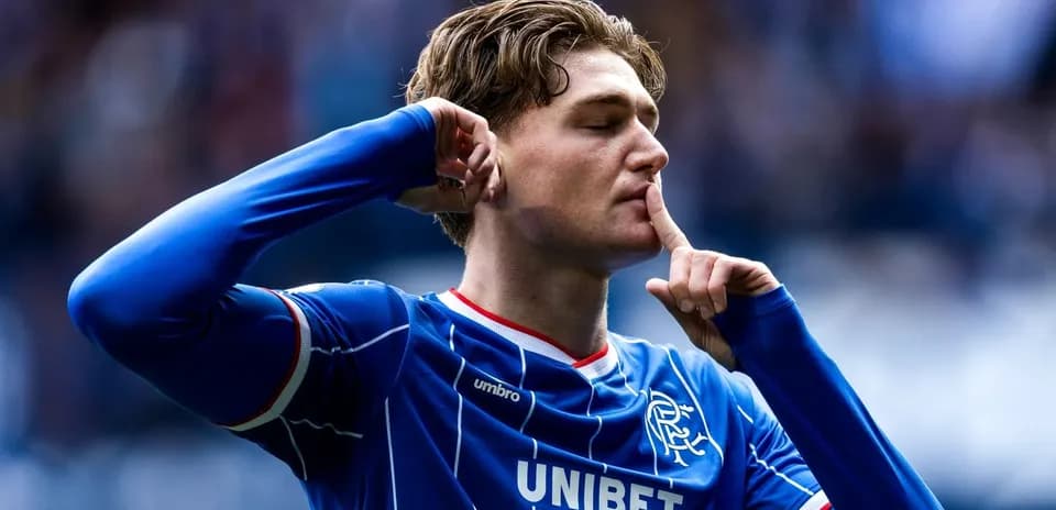 Player celebrating with a shushing gesture