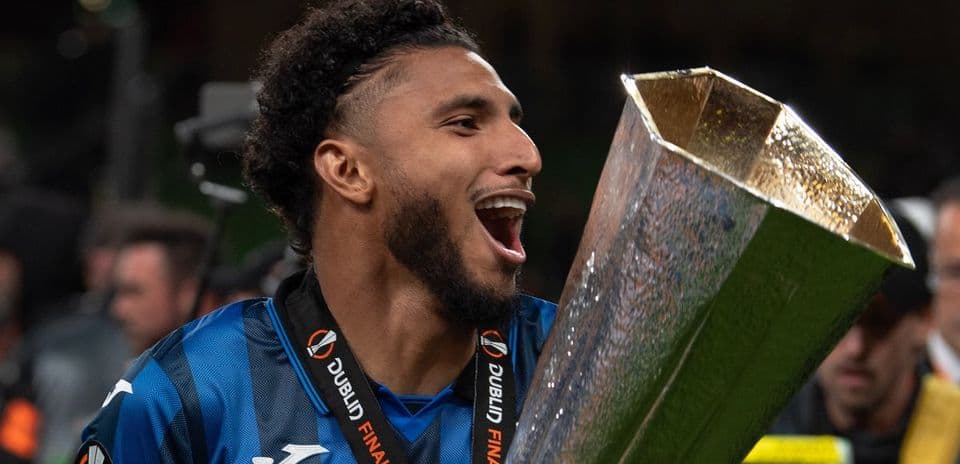 Player celebrating with trophy after winning match