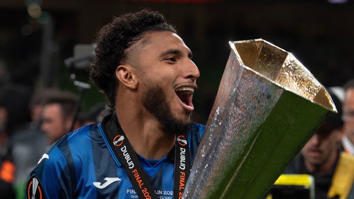 Player celebrating with trophy after winning match