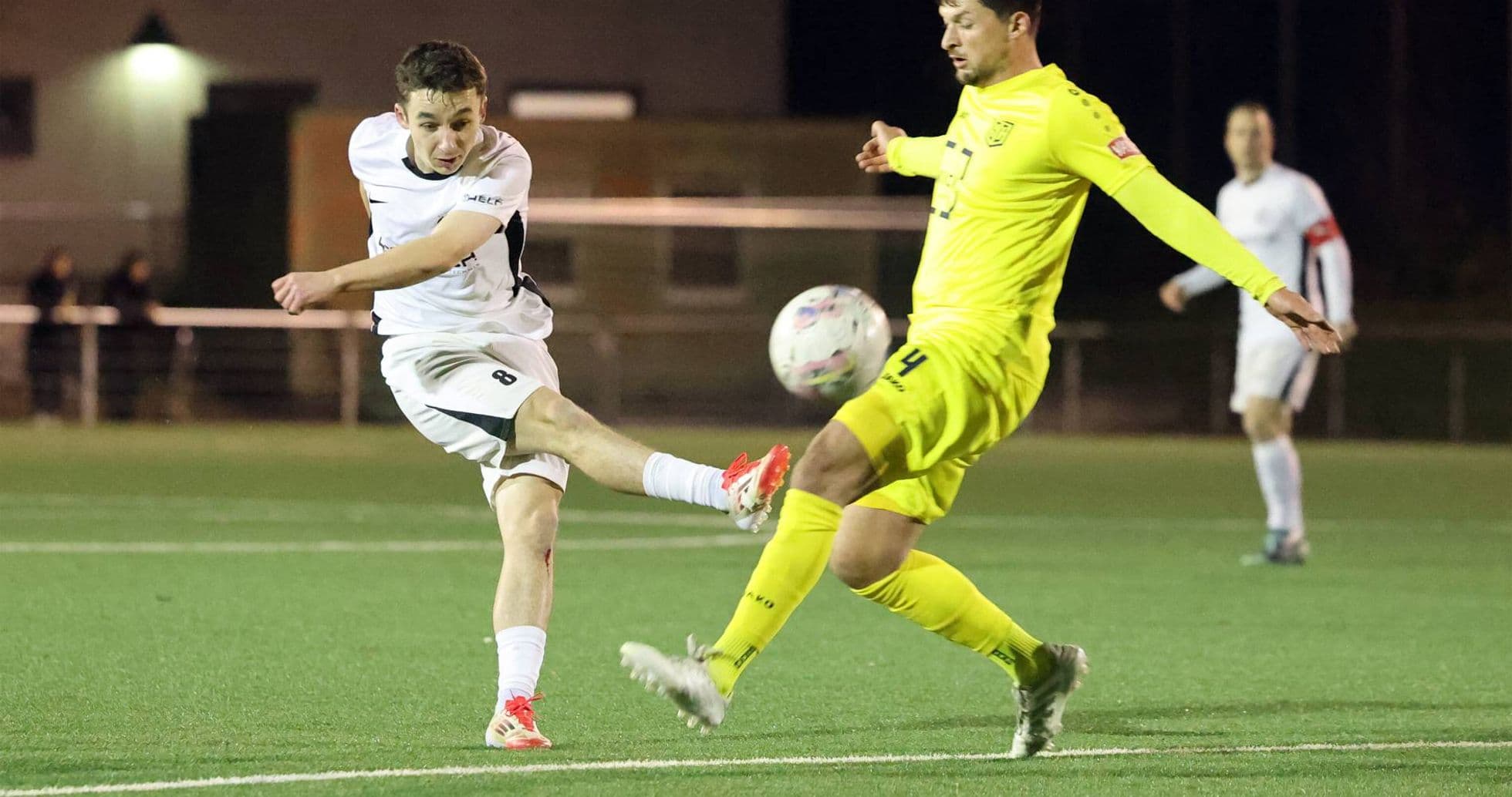 Player kicking the ball during SC St. Tönis match
