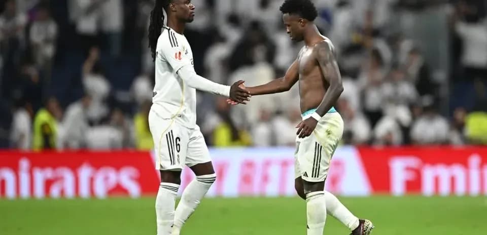 Two players shaking hands on the field