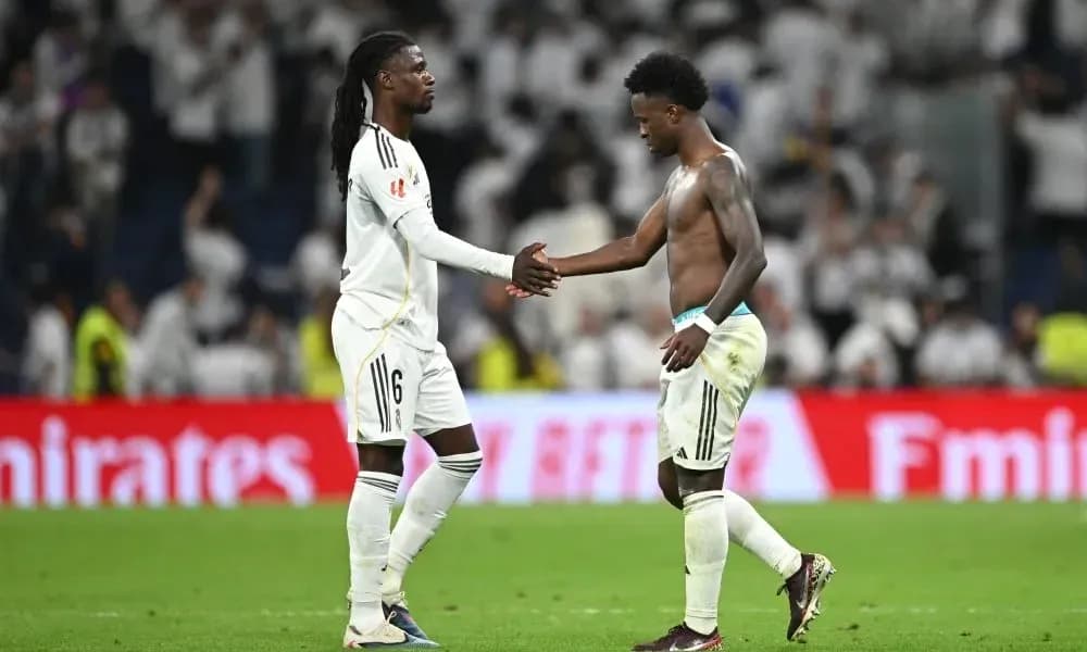 Two players shaking hands on the field