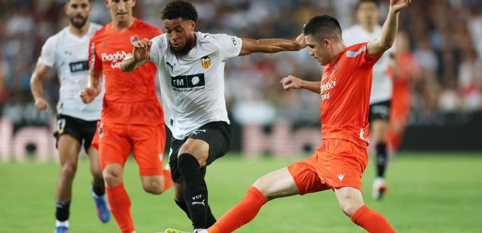Players contesting the ball during La Liga match