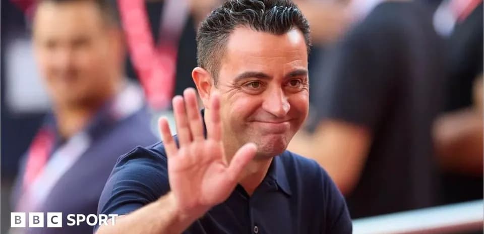 Coach waving and smiling during event