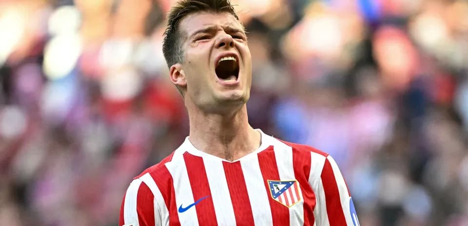 Player celebrating passionately during match for Atlético Madrid