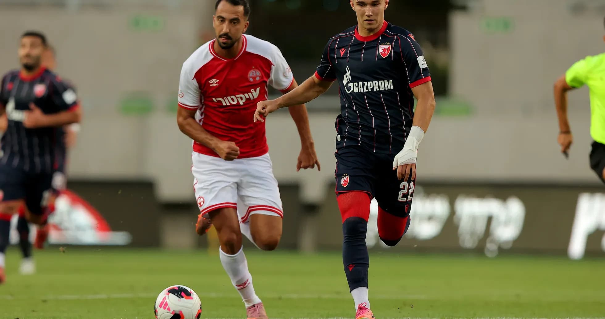 Players from Crvena Zvezda and Hapoel Beer Sheva in action