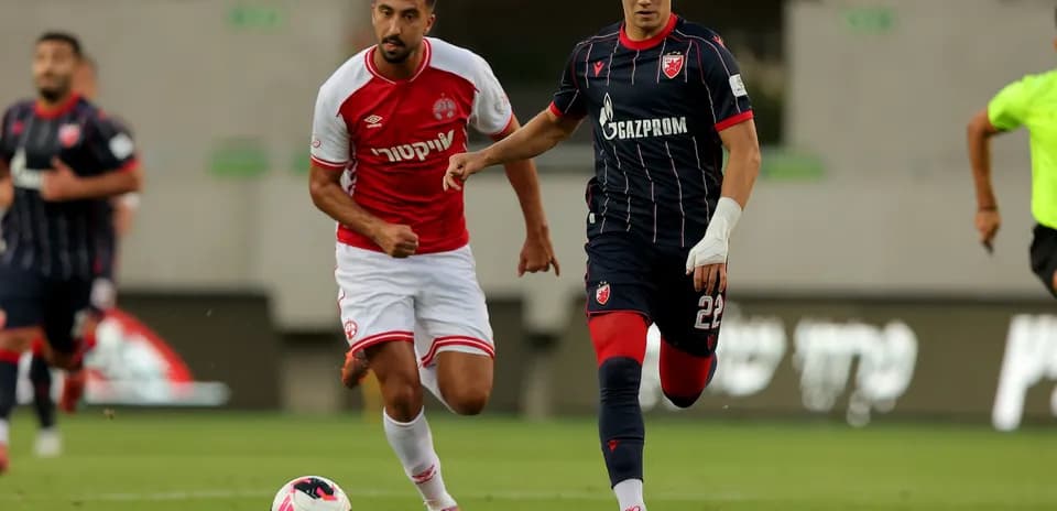 Players from Crvena Zvezda and Hapoel Beer Sheva in action