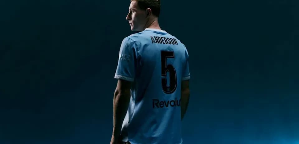 Player wearing light blue jersey with number 5