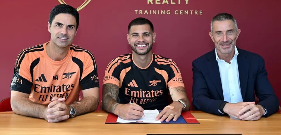 New player signing contract with team officials