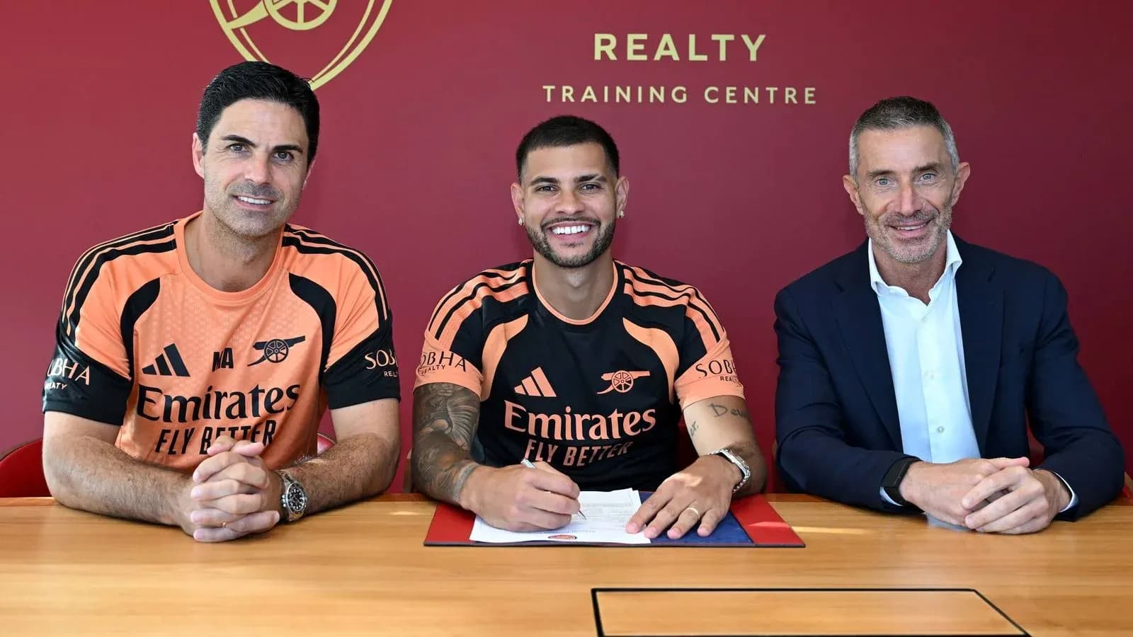 New player signing contract with team officials