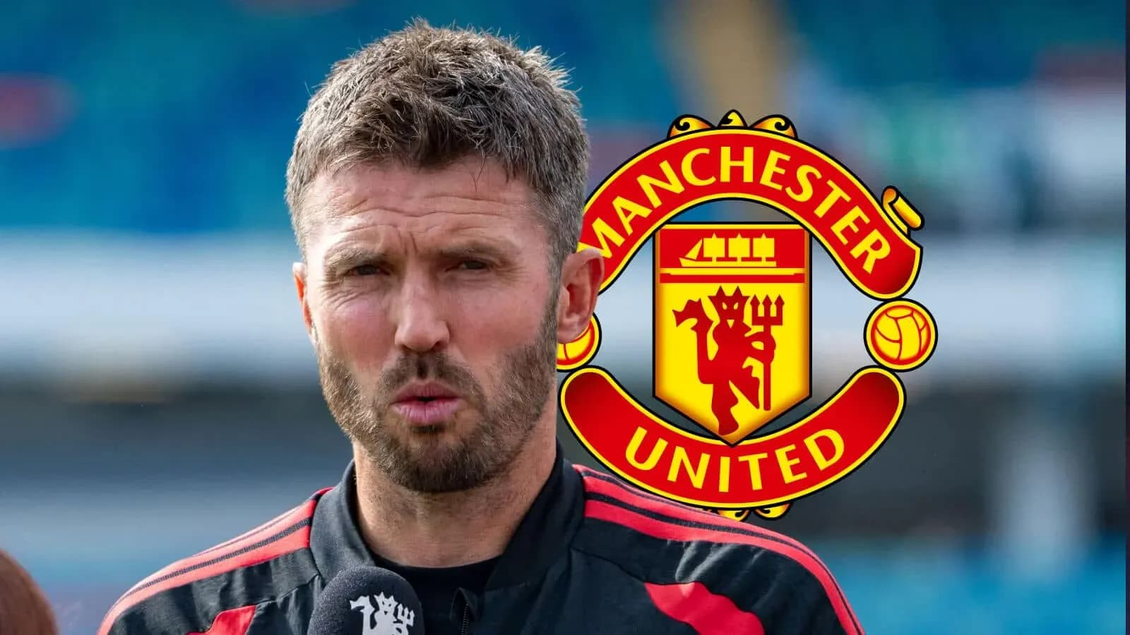 Coach speaking during press conference with Manchester United logo