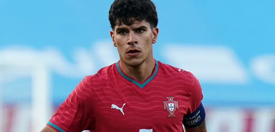 Player in red Portugal kit during match