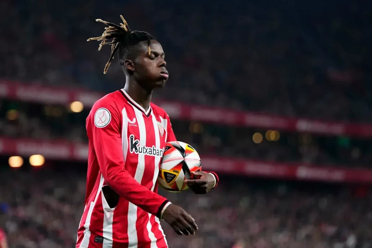 Player holding ball during match at stadium