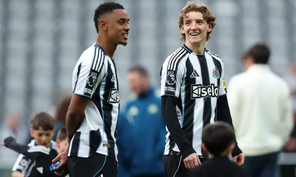 Two Newcastle players chatting during training session