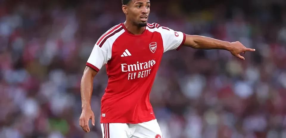 Player gesturing during a match for Arsenal
