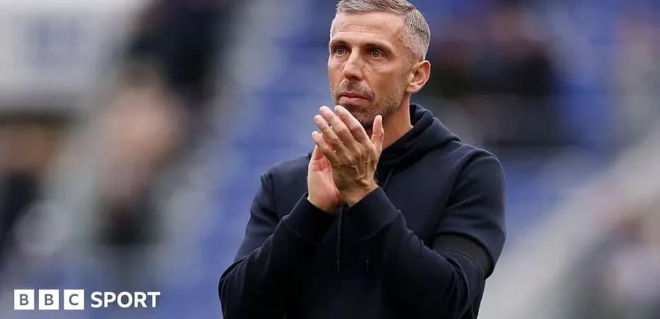 Manager applauding fans during match at stadium