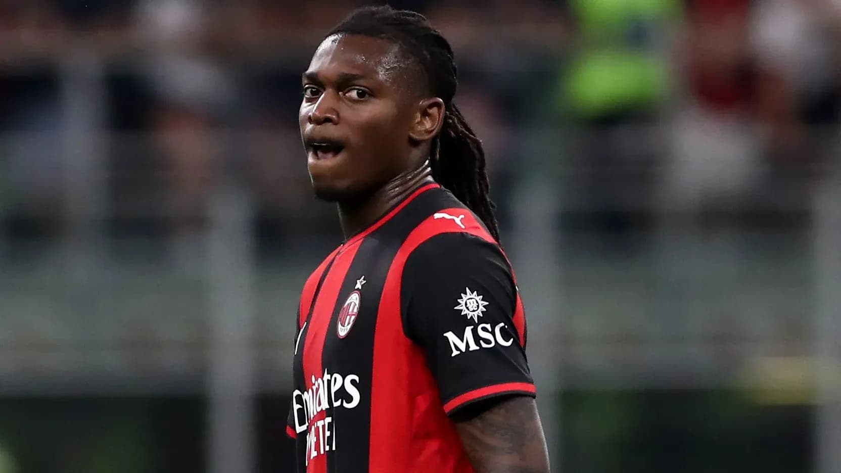 Player in AC Milan jersey during match