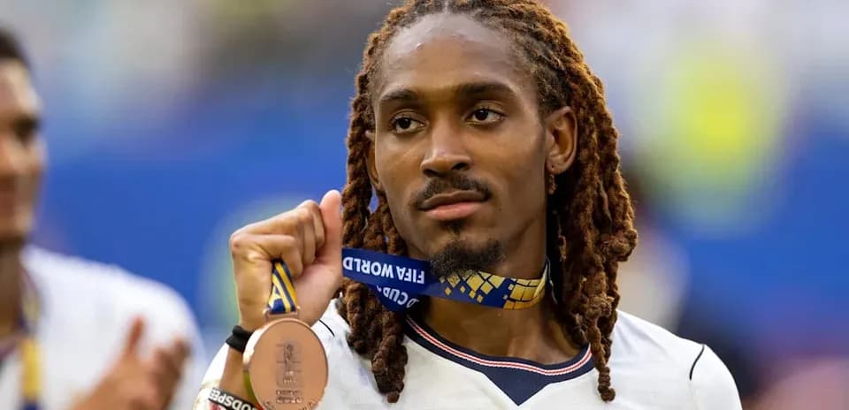 Player holding bronze medal after tournament victory