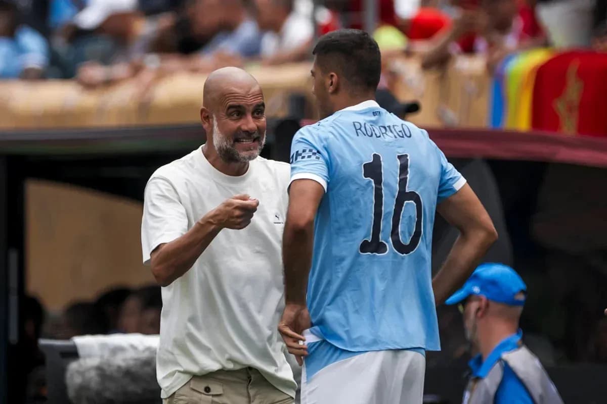Coach discussing strategy with player Rodrigo on sidelines
