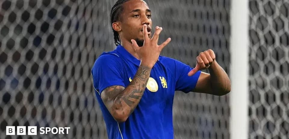 Player celebrating a goal with hand gestures
