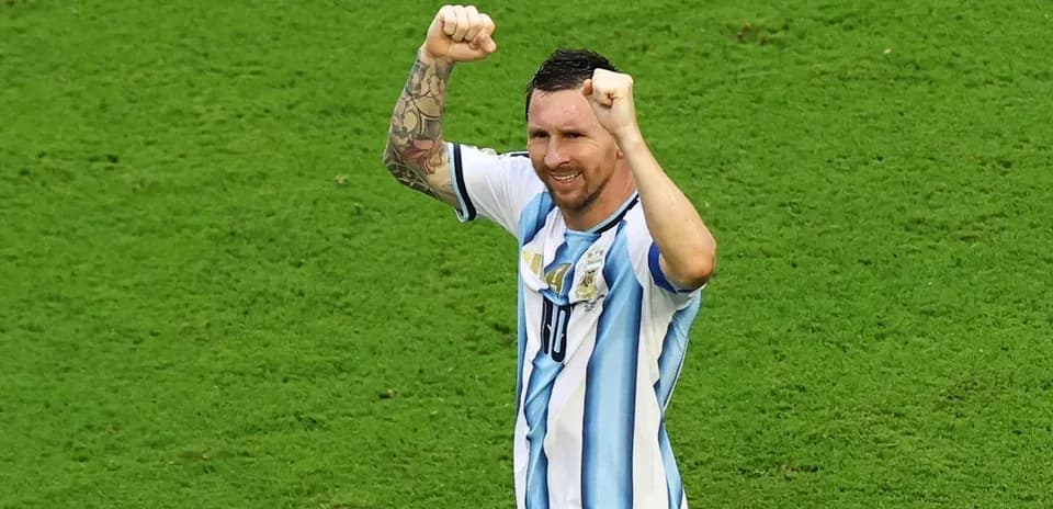 Player celebrating with raised fists on field