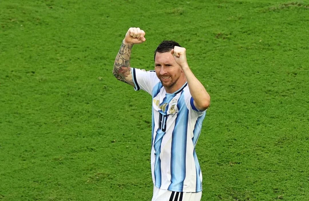 Player celebrating with raised fists on field