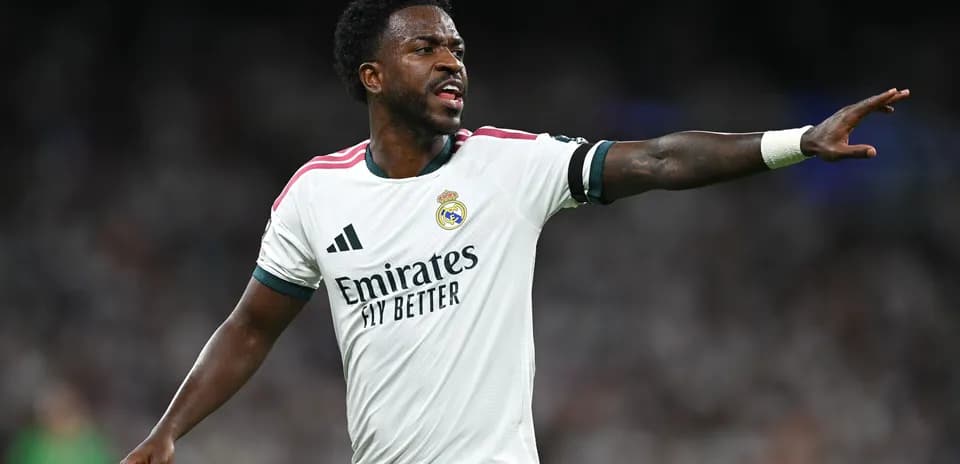Player gesturing during match in white kit