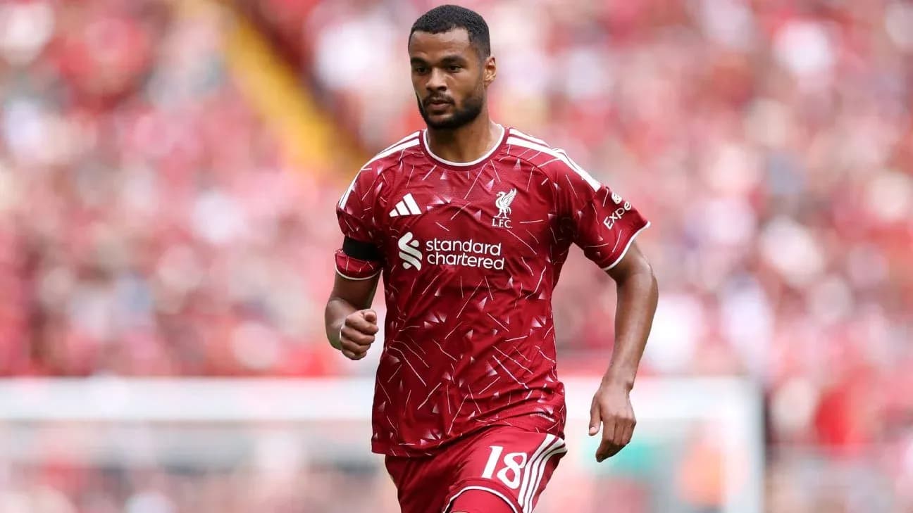 Player walking on the pitch in Liverpool kit