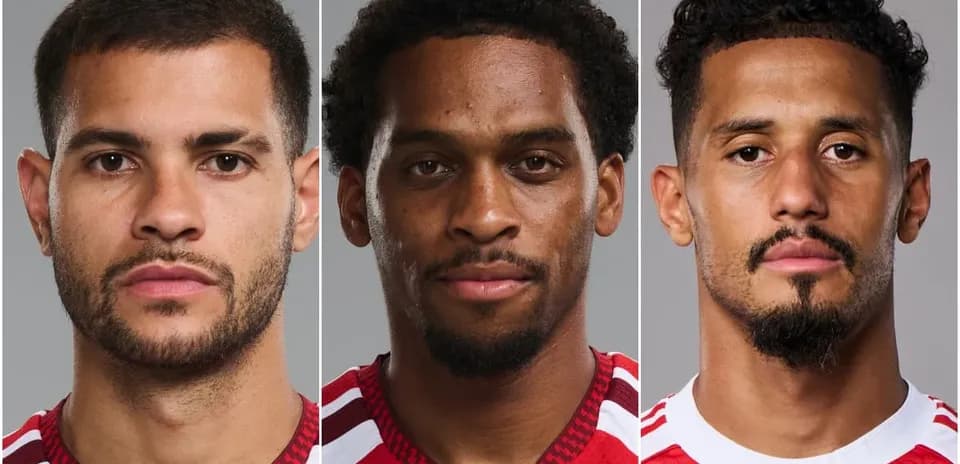 Three players posing for headshots in red jerseys