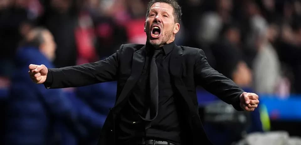 Coach celebrating passionately during a match