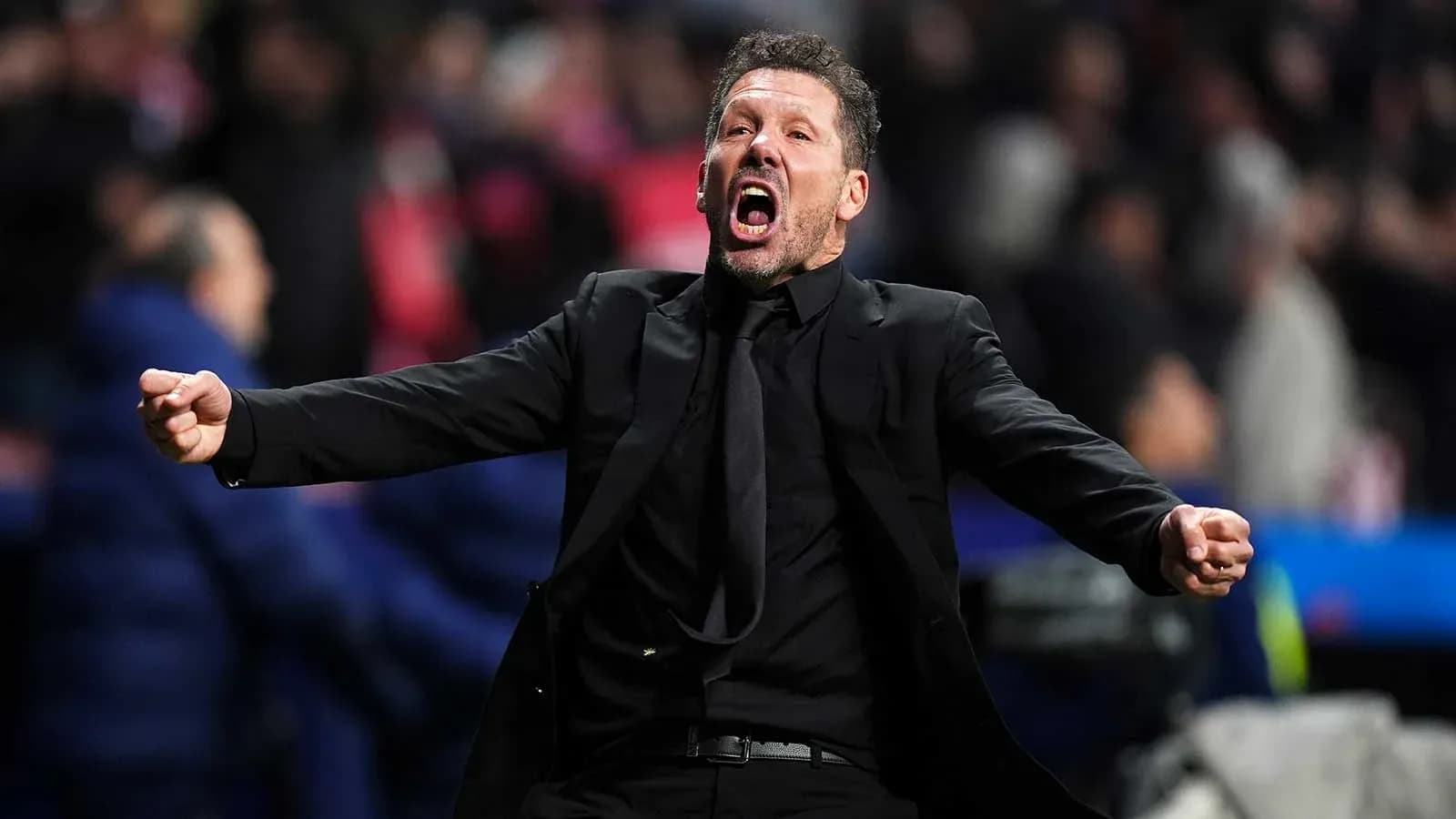 Coach celebrating passionately during a match