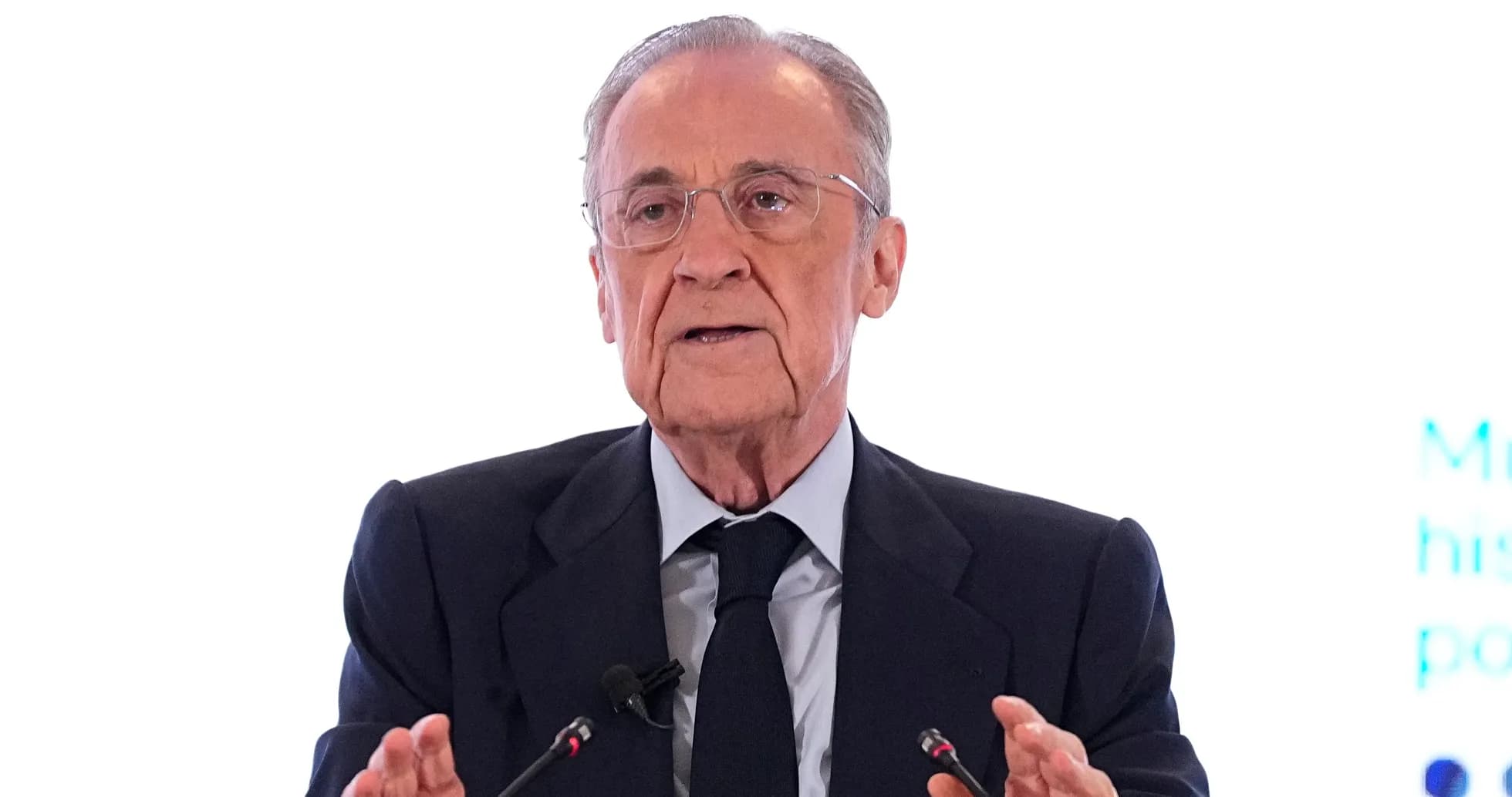 Man speaking at a podium during a conference