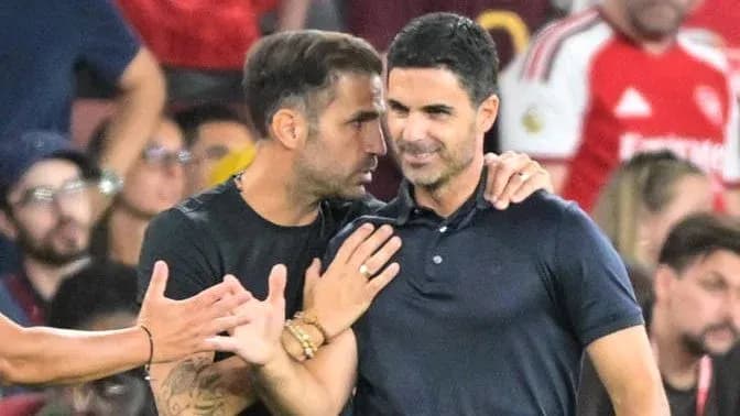 Two coaches discussing during a match