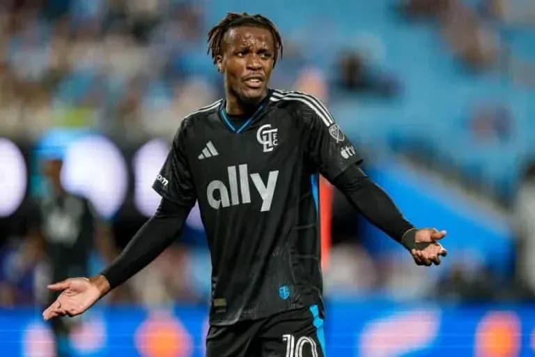 Player in black jersey gesturing during match