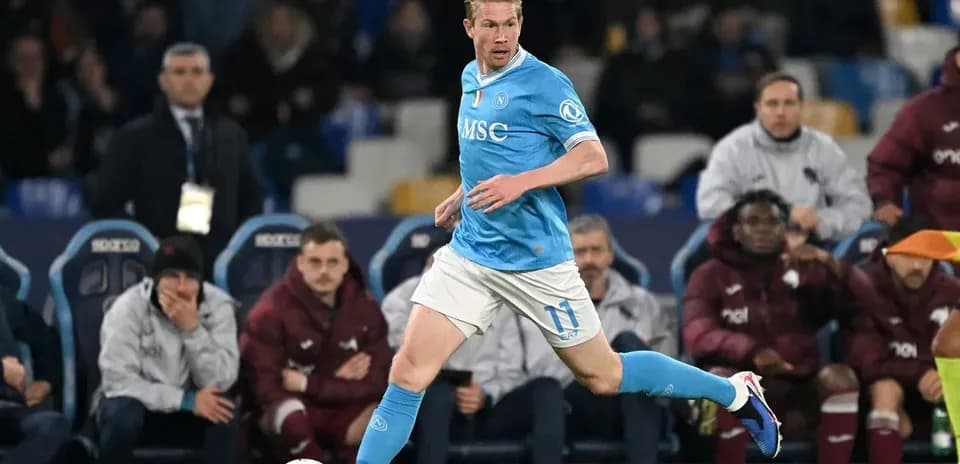 Player in blue jersey running with the ball
