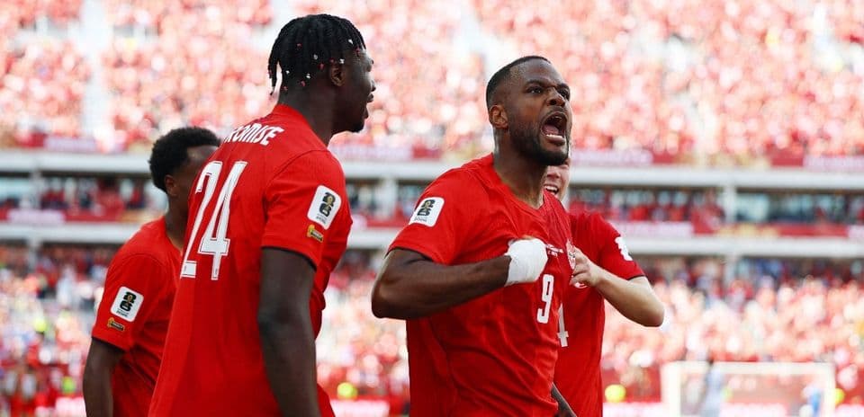 Canada players celebrating a goal during match