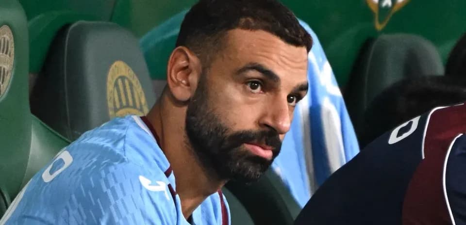 Player sitting on bench during match