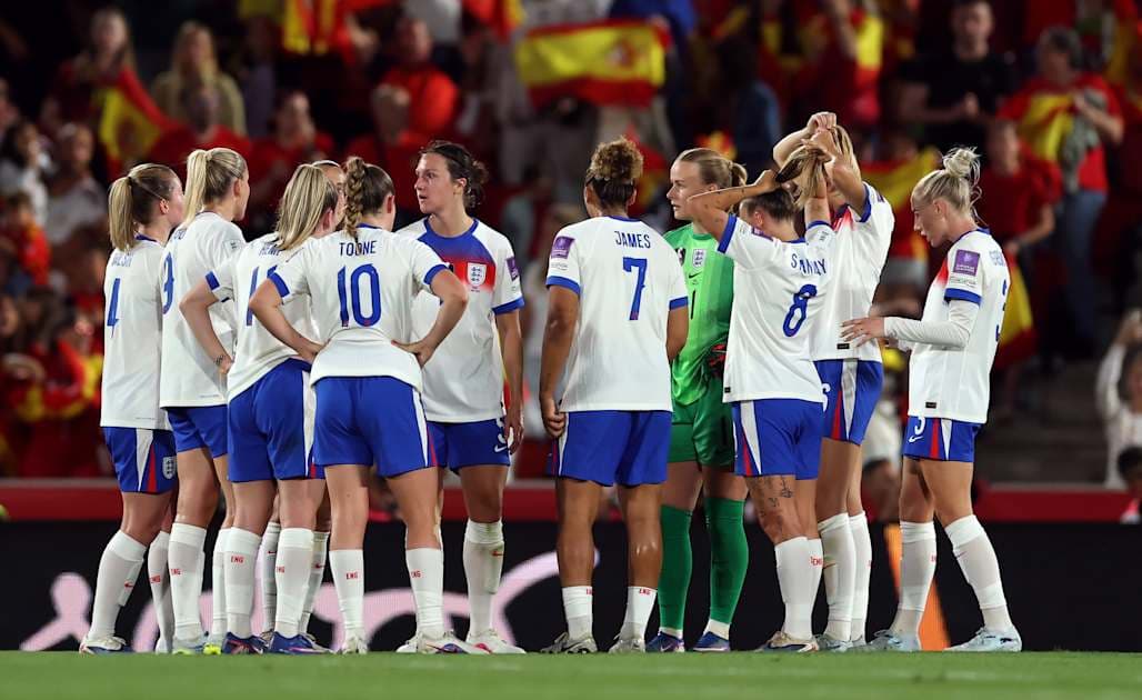 England women's team huddled during match preparation
