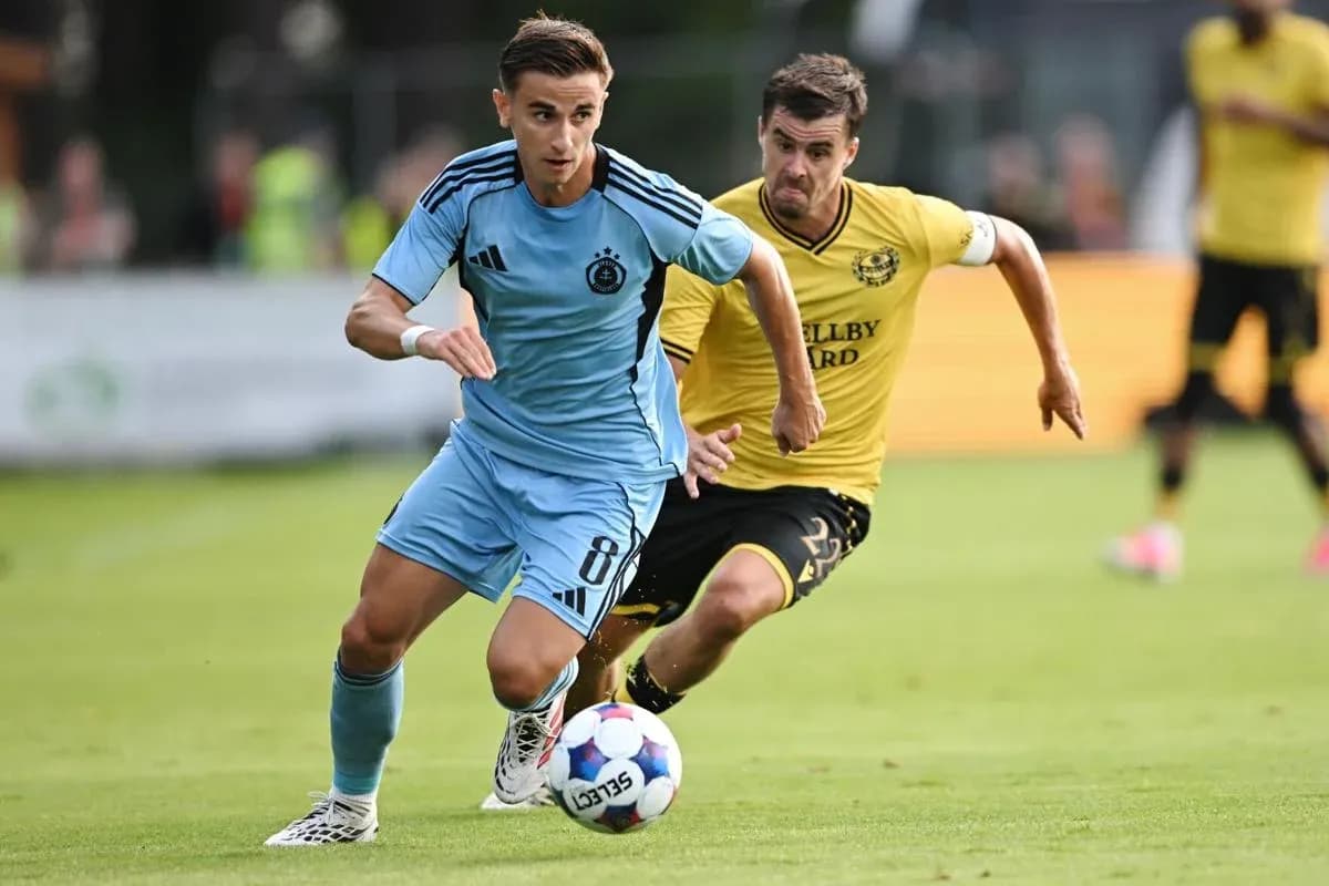 Player dribbling the ball during football match