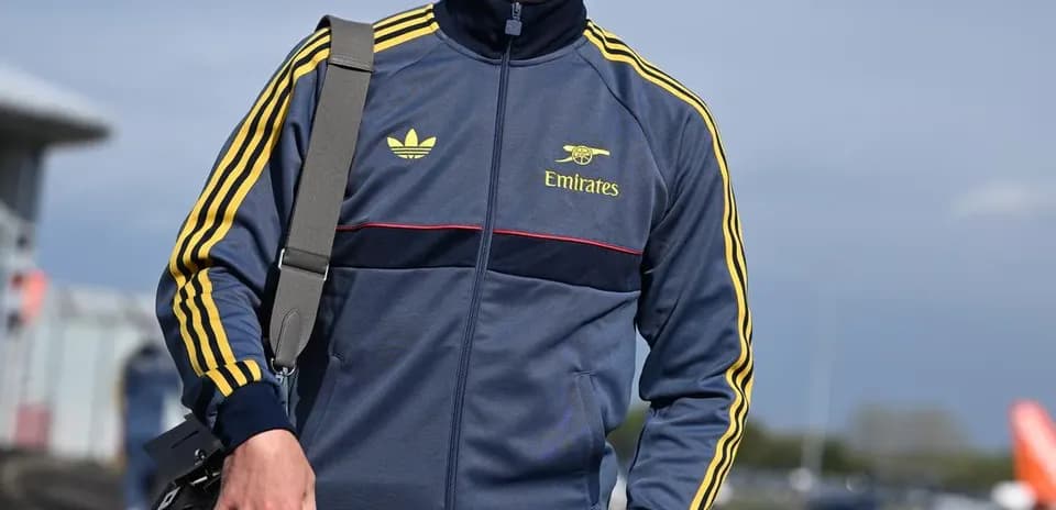 Man in sportswear walking with a bag