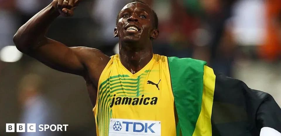 Athlete celebrating victory wearing Jamaican colors