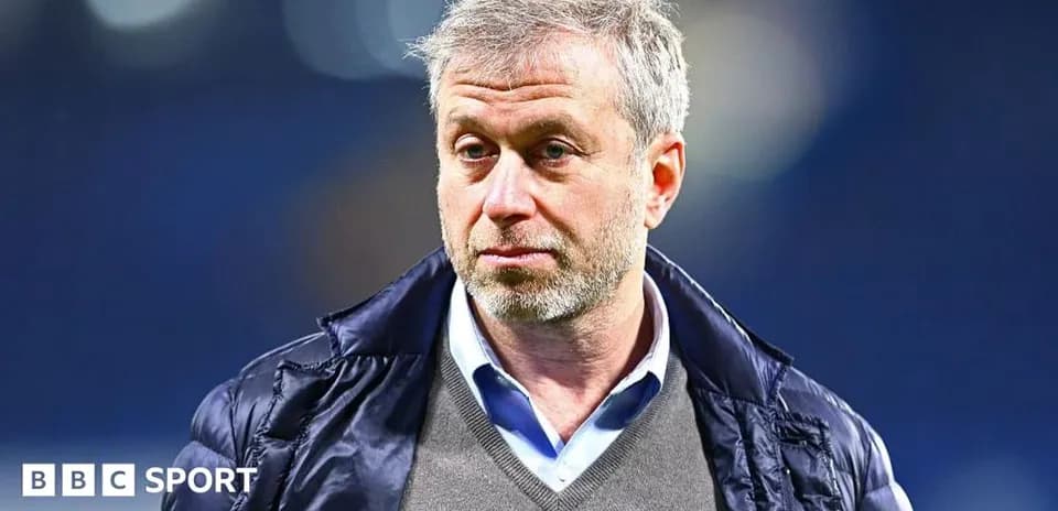 Man in jacket with short gray hair looking serious