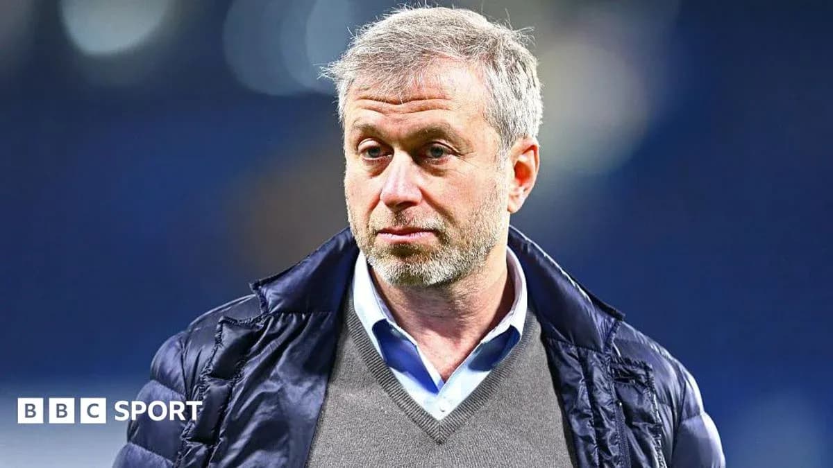 Man in jacket with short gray hair looking serious