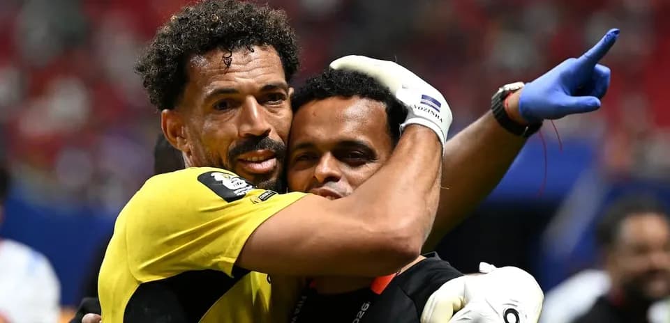 Goalkeeper and coach celebrating after match
