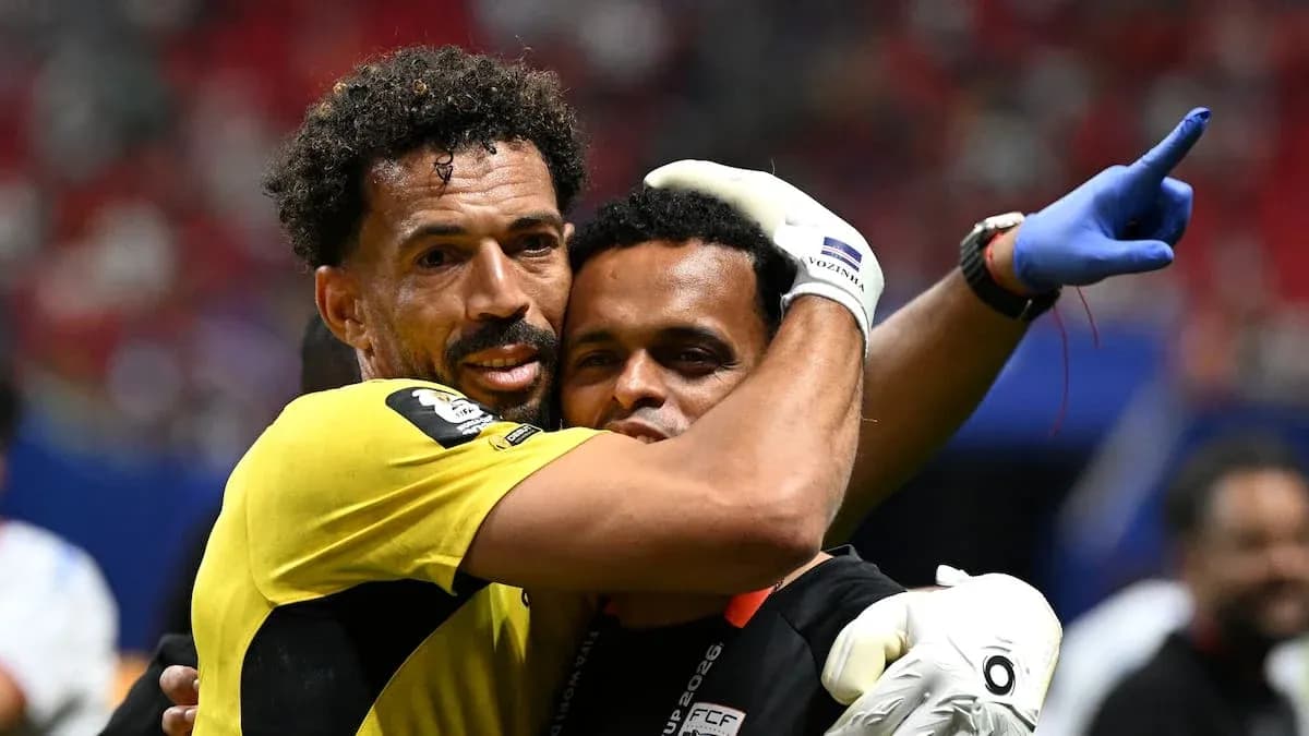Goalkeeper and coach celebrating after match