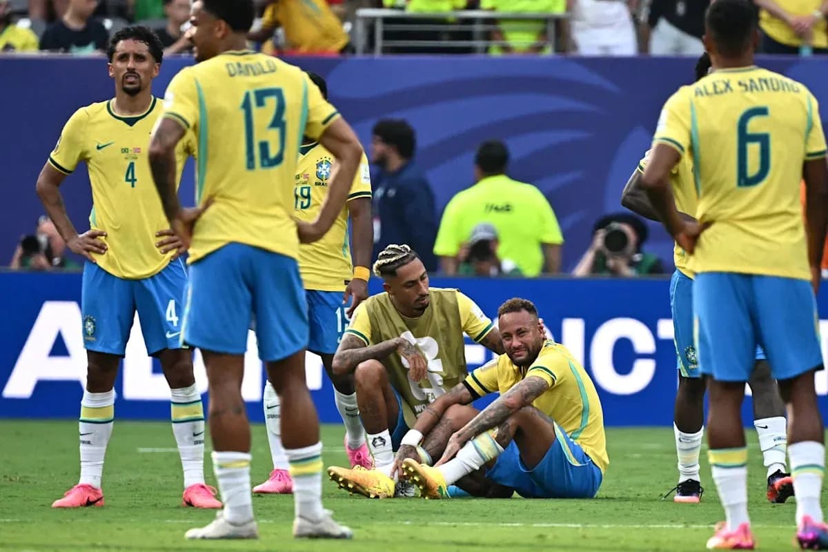 Brazilian players gathered around injured teammate Neymar