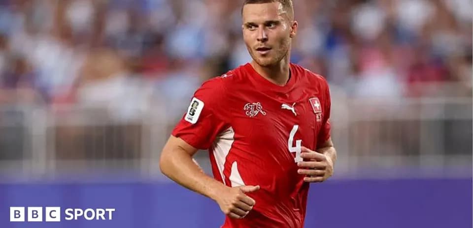 Swiss player wearing red jersey during match