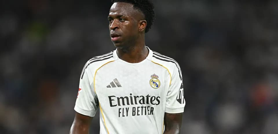 Player wearing Real Madrid jersey on the pitch