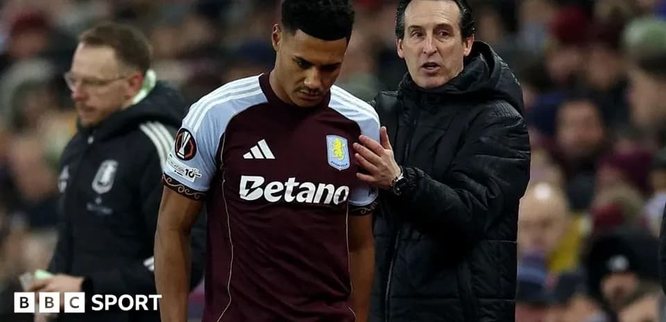 Aston Villa player receiving instructions from coach