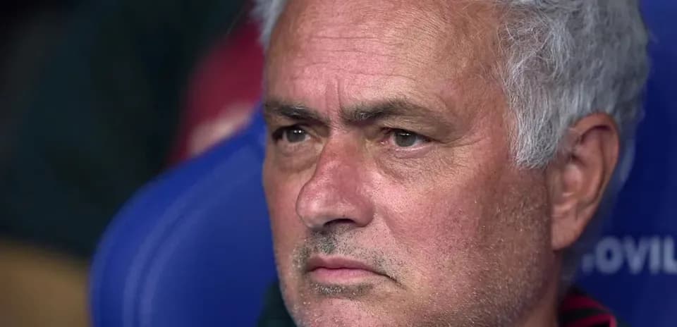 Coach sitting on the bench during the match